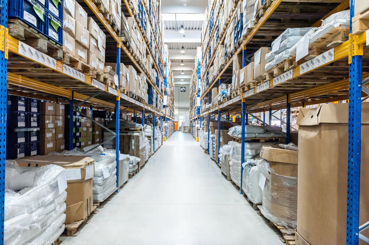 Inside warehouse displaying packages on shelving units